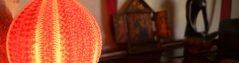 sea urchin lamp glows a warm orange